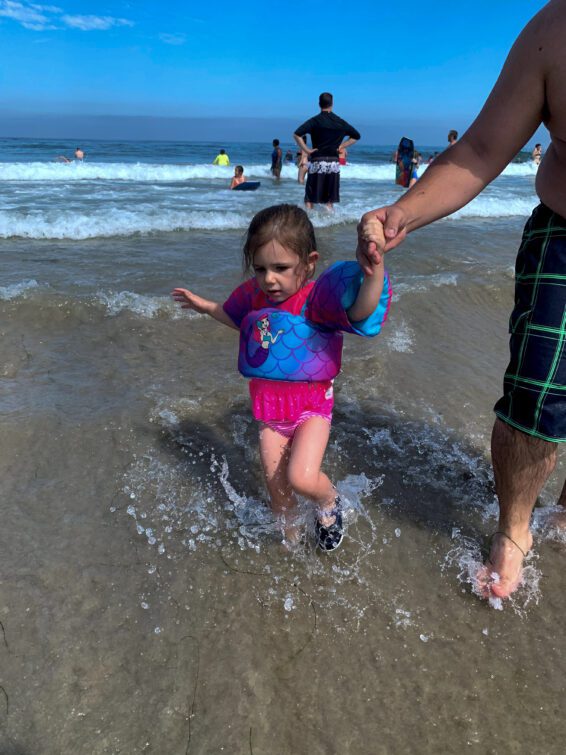 Toddler Splashing in the Waves, La Jolla Shores, San Diego Beach.