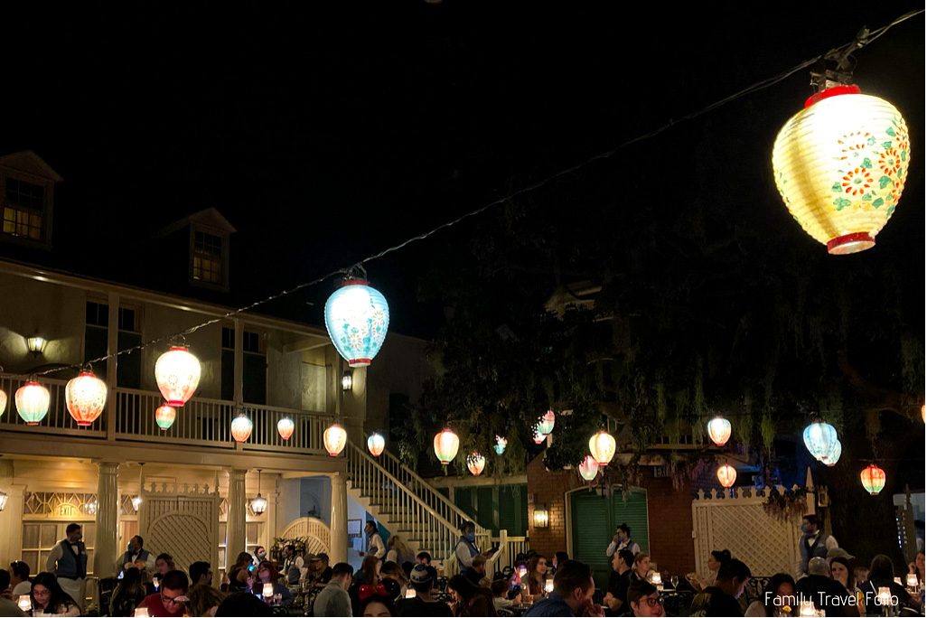 Blue Bayou Restaurant. Lanterns hanging on strings above tables.