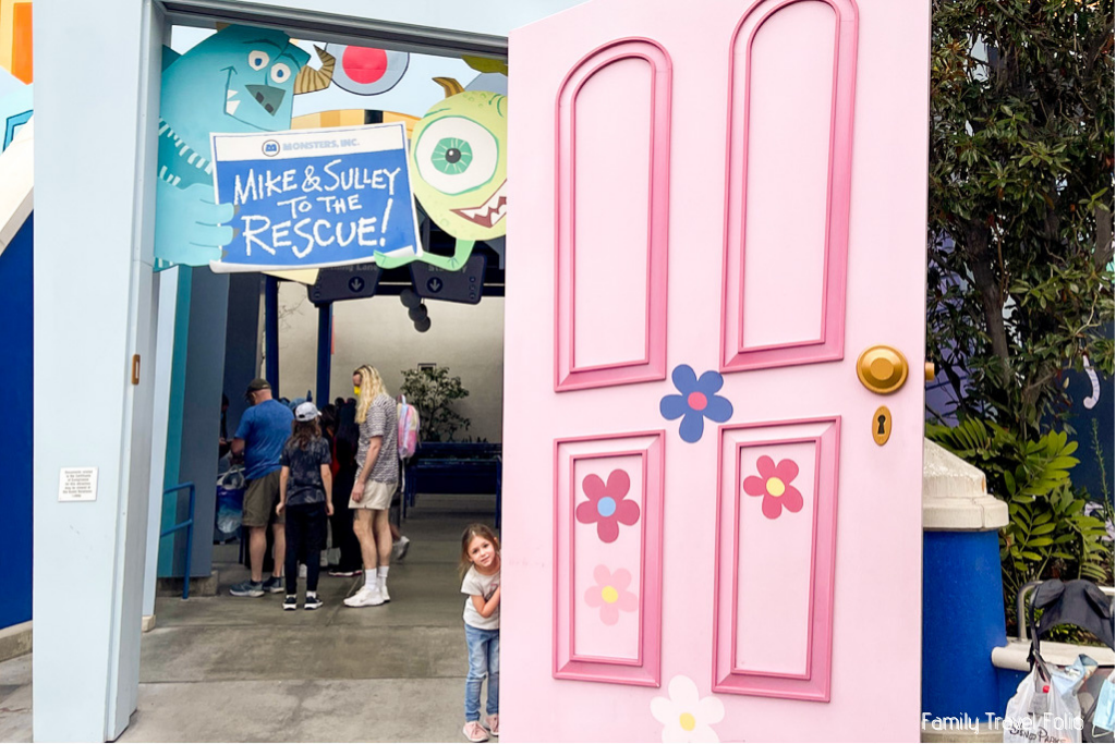 Walking through a giant version of Boo's door as the entrance to the Mike & Sulley ride at California Adventure.