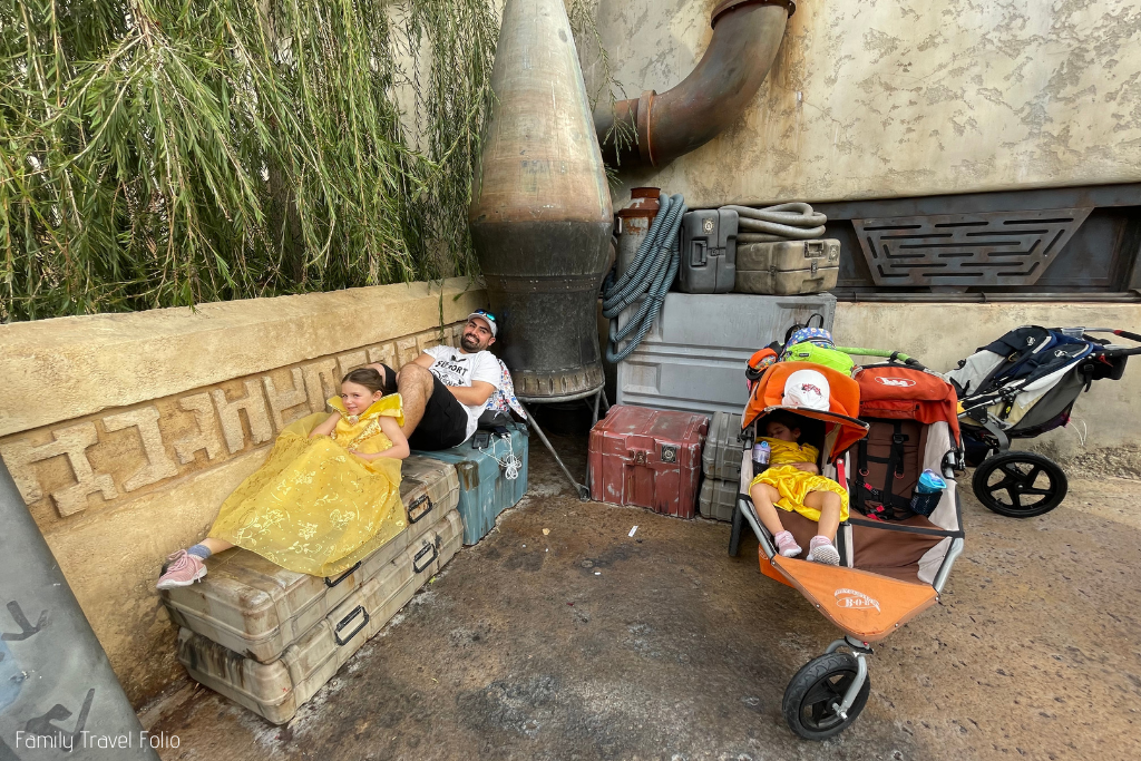 Relaxing in Batuu, napping in the stroller.