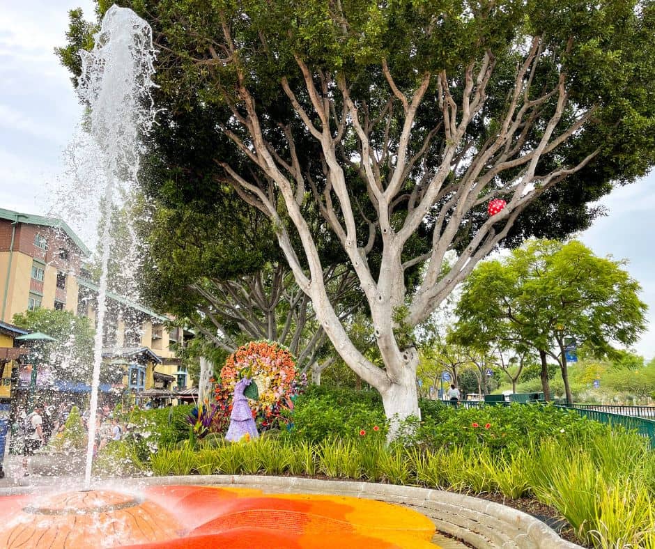 Downtown Disney fountain with Minnie pumpkin in tree and Isabela flower statue