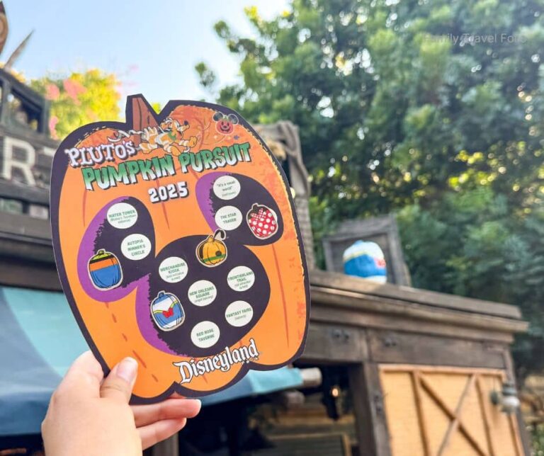 Pluto's Pumpkin Pursuit 2025 map held up at Disneyland, showing sticker locations for the Disney character pumpkin scavenger hunt.