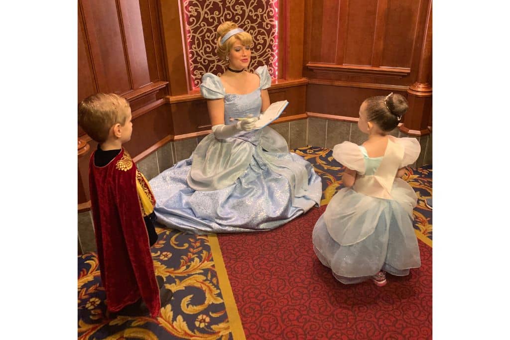 Toddler boy and girl meeting Cinderella at Disneyland Royal Hall