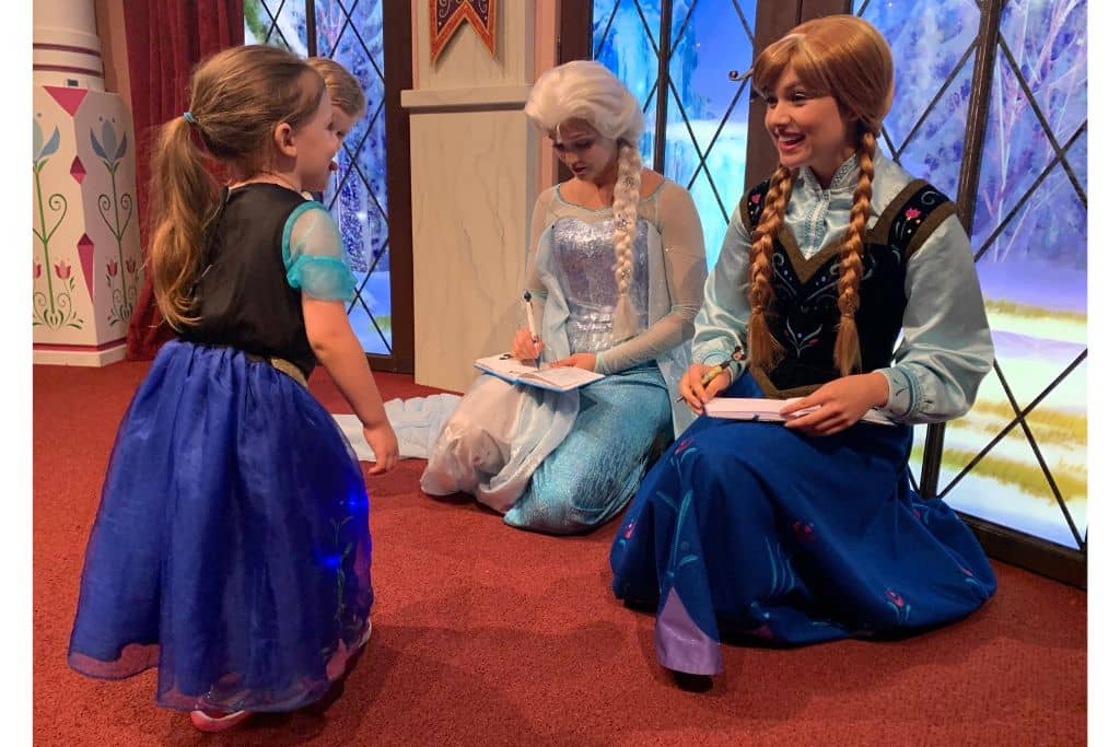 Toddler girl in Anna dress Meeting Anna and Elsa California Adventure