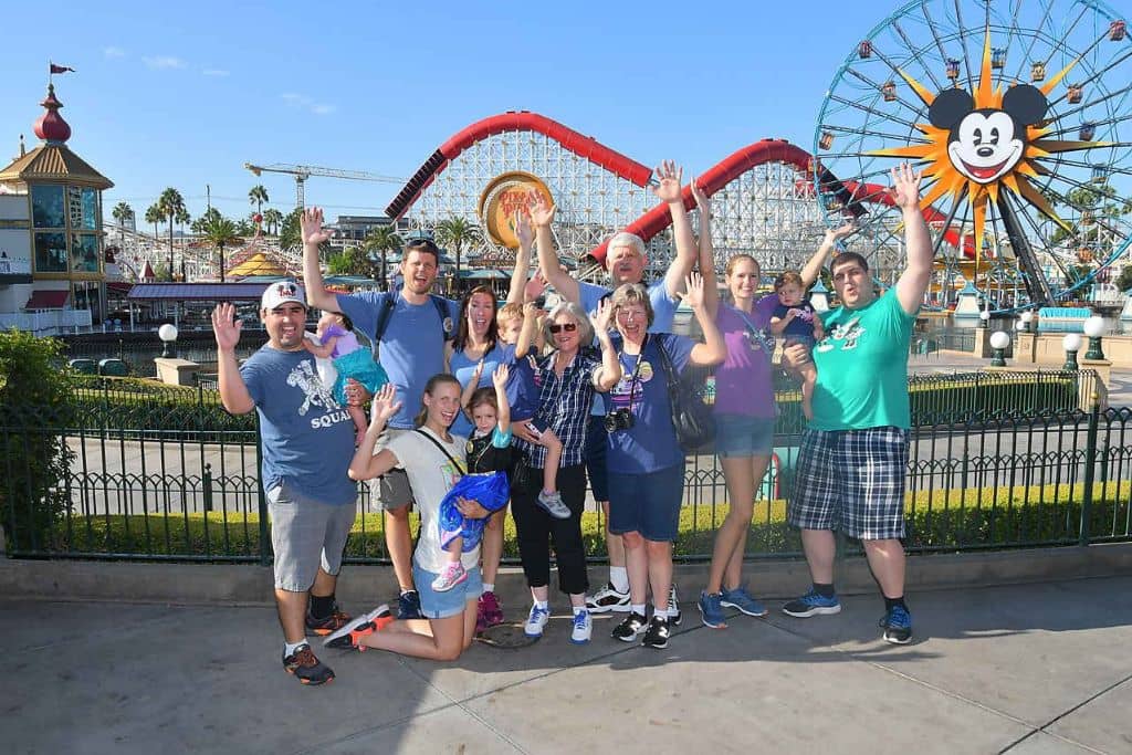 Photo Pass group family photo at California Adventure, Pixar Pier in background