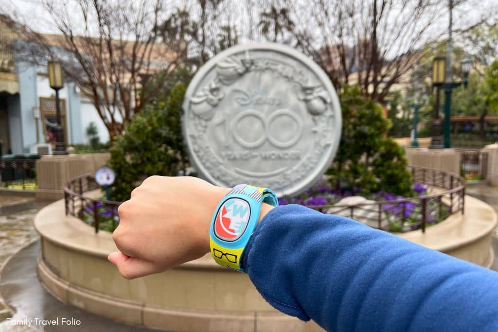 wrist with magicband+ triggering Disney100 Medallion interaction