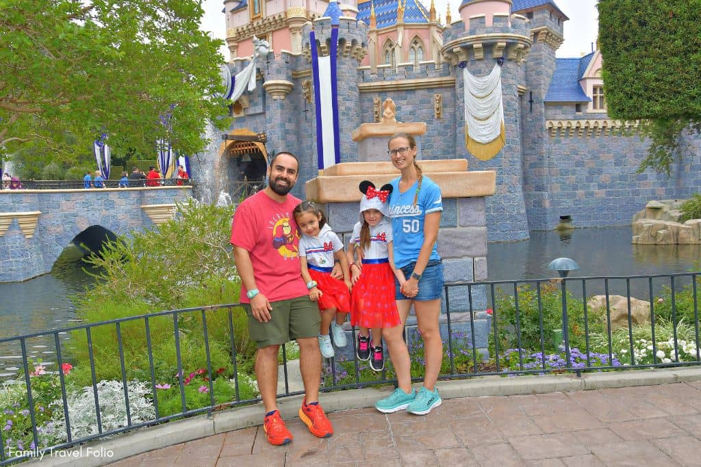 Disneyland Castle Family PhotoPass Photo with family wearing MagicBands+