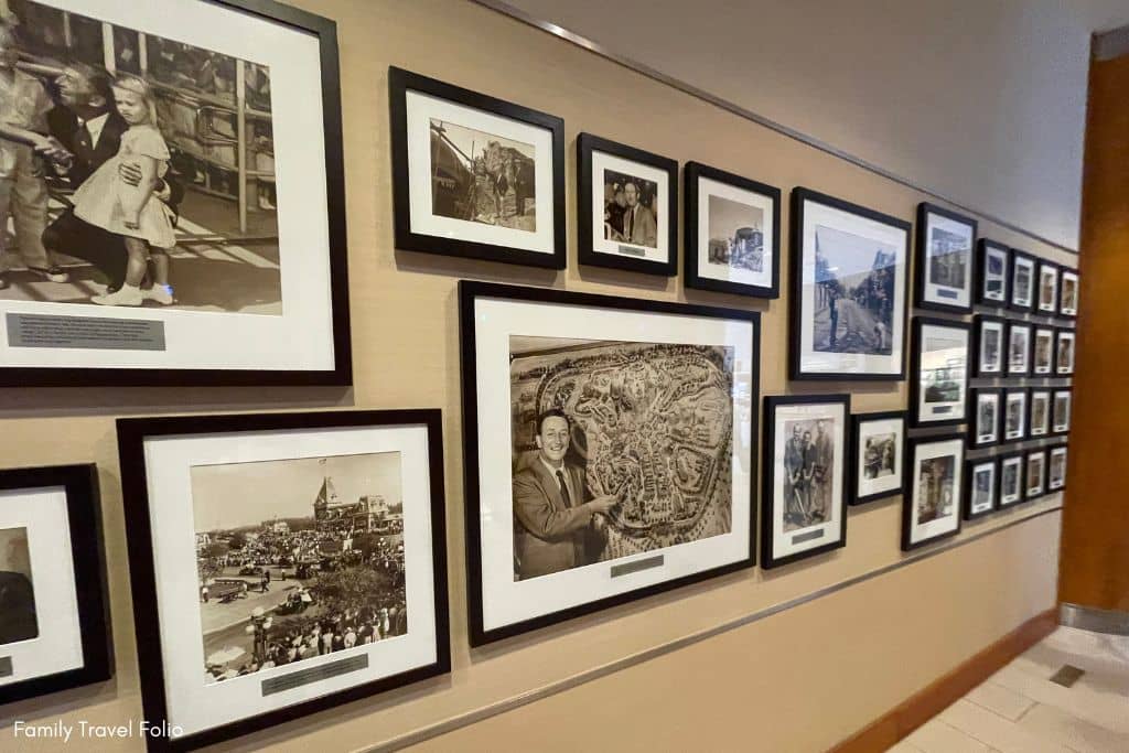 Historic black and white photos of Walt Disney and Disneyland's past adorn a wall inside the Disneyland Hotel.