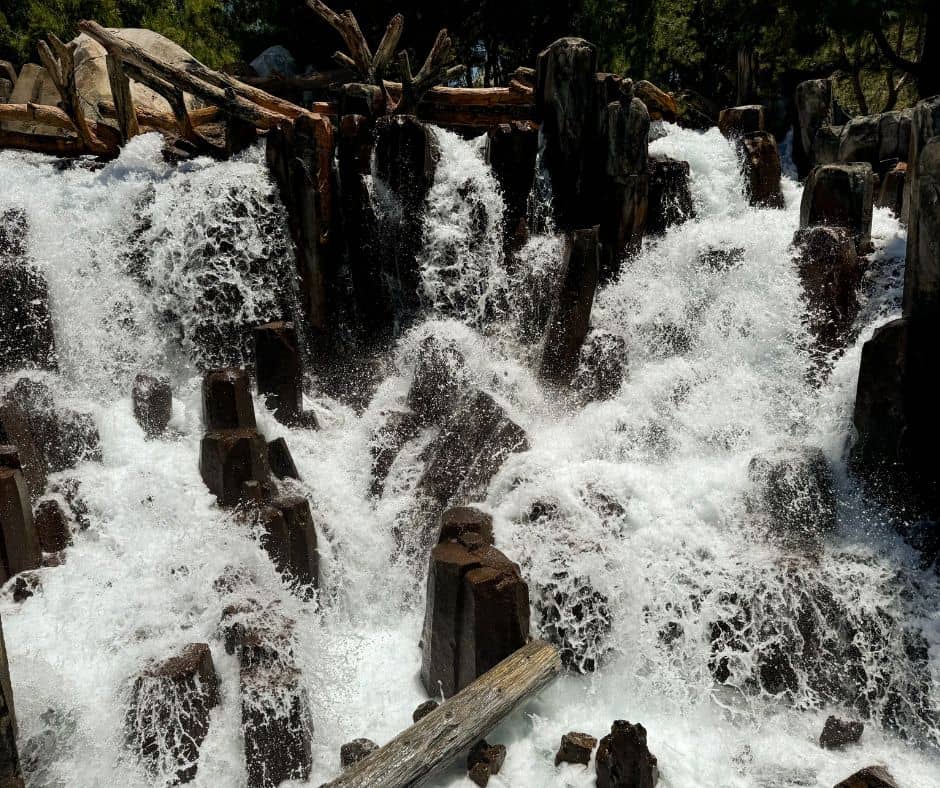 A powerful waterfall at California Adventure in Disneyland Resort, offering a natural and refreshing sight amidst the hot weather.